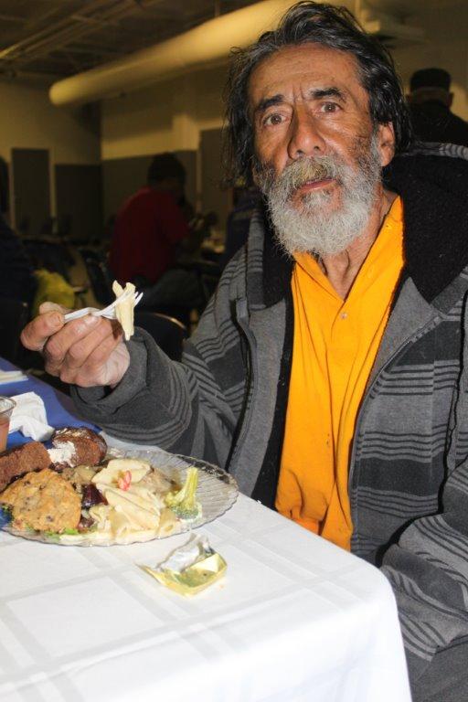 Thankful diner at Thanksgiving Dinner at Cardinal Manning Center in the heart of LA's Skid Row.