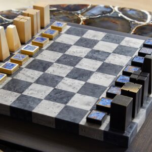 Bespoke Lapis Chessboard Set’ in bronze, brass, veneers & lapis lazuli, edition of 20, 40 x 40cm, (£6,250) (AEDITIONS / Marie Soliman)