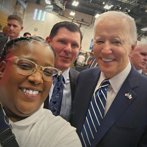 Backstage at a Syracuse event where she introduced President Joe Biden, Local 43 member Shawni Davis captures a selfie with the president and her proud business manager, Alan Marzullo, who said she “hit a grand slam” with her remarks. Photo: Courtesy of IBEW via 360 MAGAZINE. 

