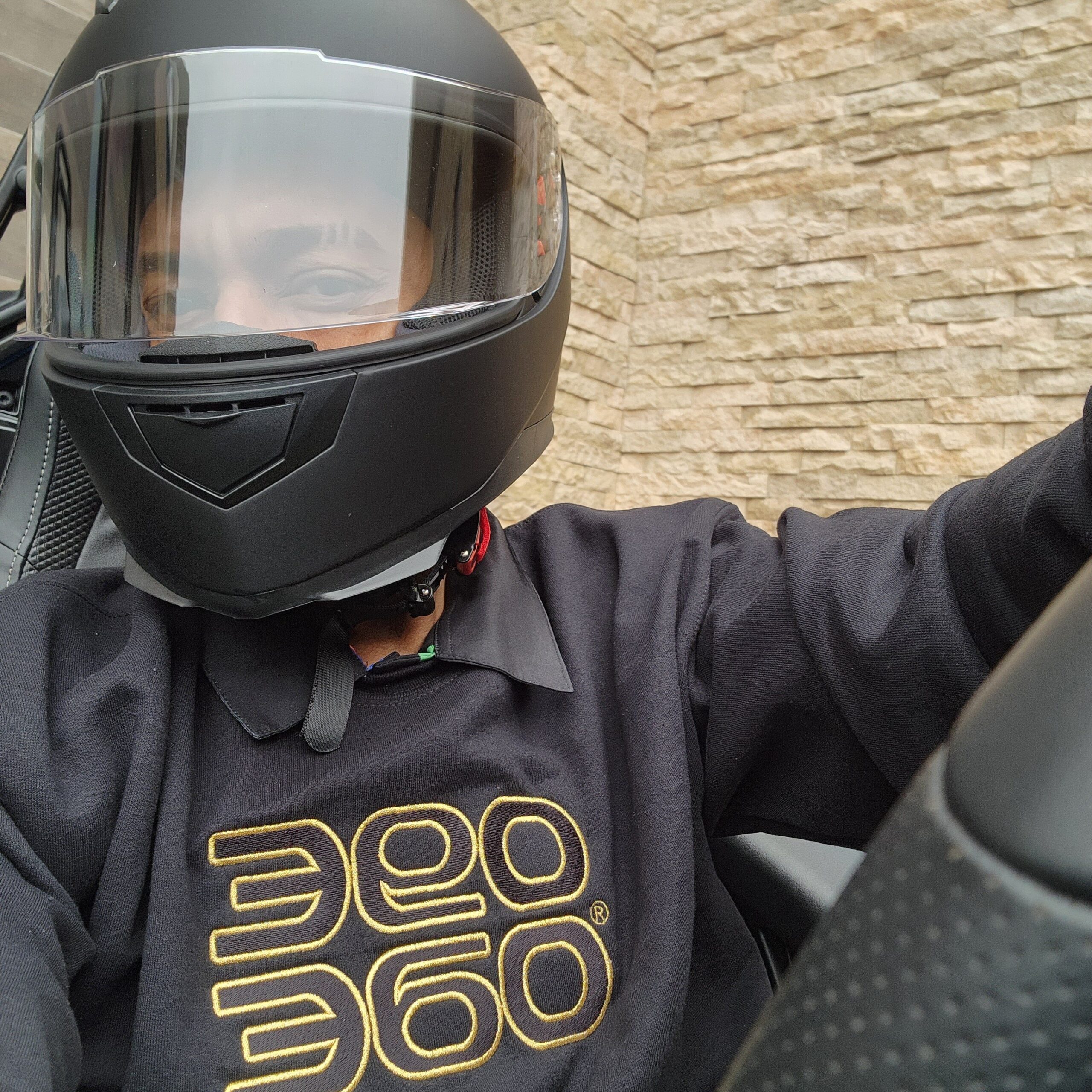 Vaughn wears ultra limited edition '360 sandwich' embroidered sweatshirt with ILM motorcycle helmet. 