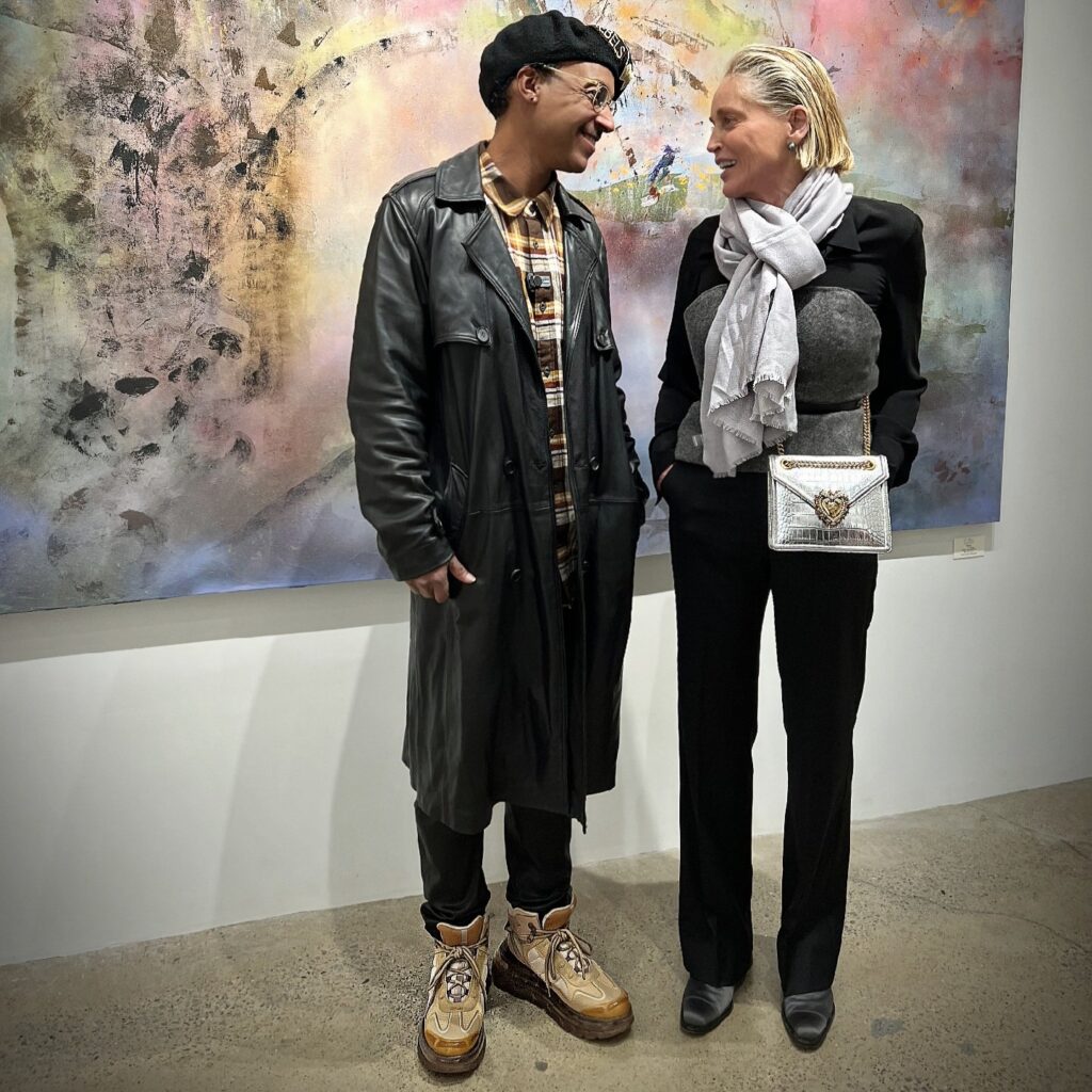 Vaughn Lowery and Sharon Stone at art exhibition in Greenwich, Connecticut at C. Parker Gallery via 360 MAGAZINE. 