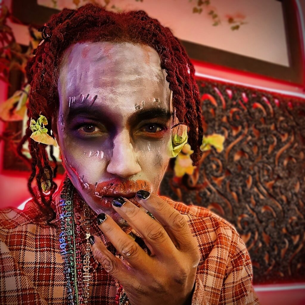 Vaughn Lowery dresses up as zombie rasta joker for Halloween via 360 MAGAZINE. 