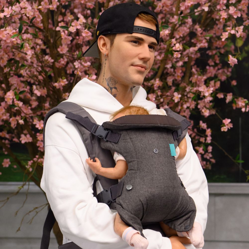 Justin Bieber and baby carrier via Madame Tussauds London and 360 MAGAZINE. 